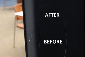 Before and after image of scratches being buffed out of a black aluminum surface
