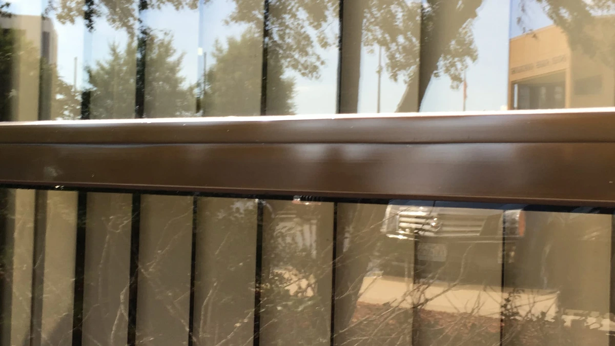Exterior window metal joint that has been refinished and cleaned of weather deposits