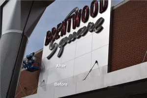 Mid America Specialty Services contractors cleaning and refinishing an aluminum shopping center sign