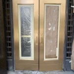 Metal entrance doors after refinishing