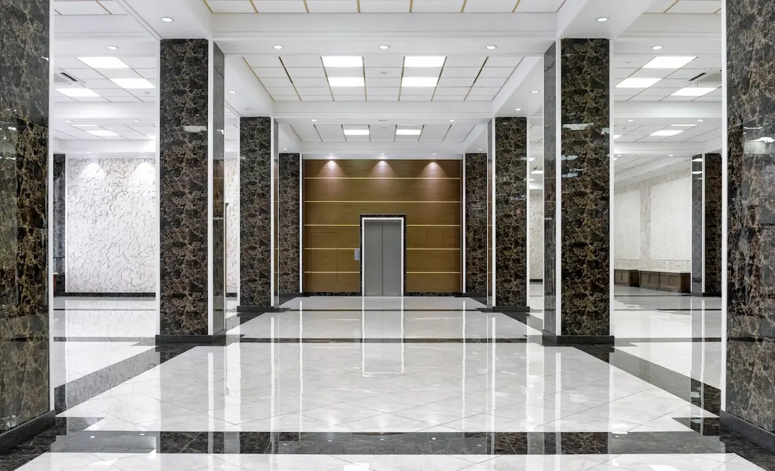 Stone floor interior of commercial building with elevator