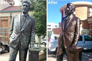 refinished bronze statue on a university campus