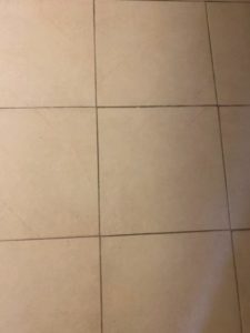Tile floor before grout cleaning