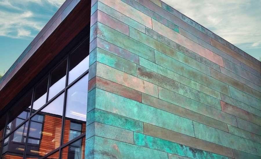 Copper facade of a commercial building that has experienced weathering