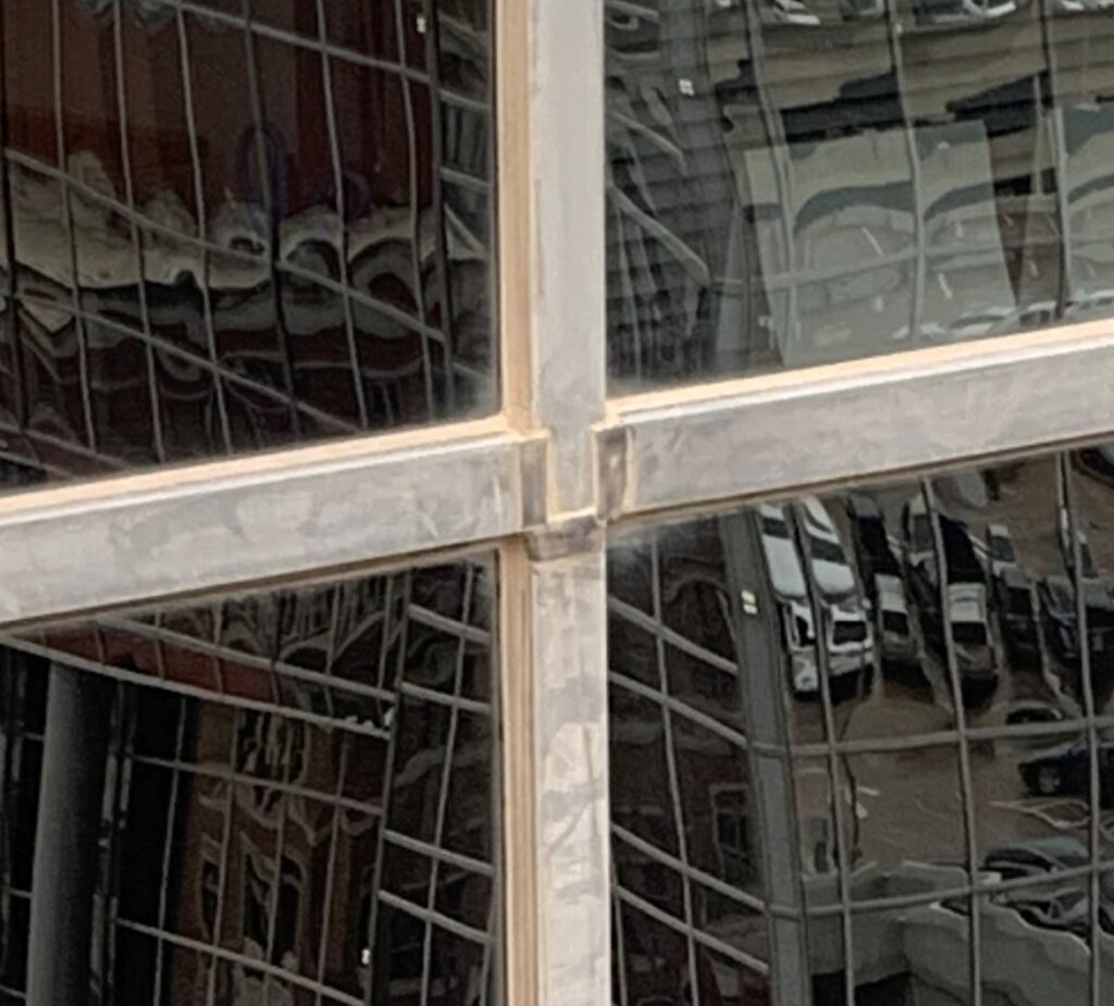 Damaged aluminum window frame