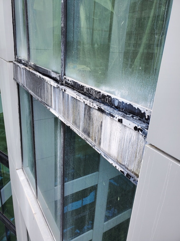 Damaged aluminum window frame